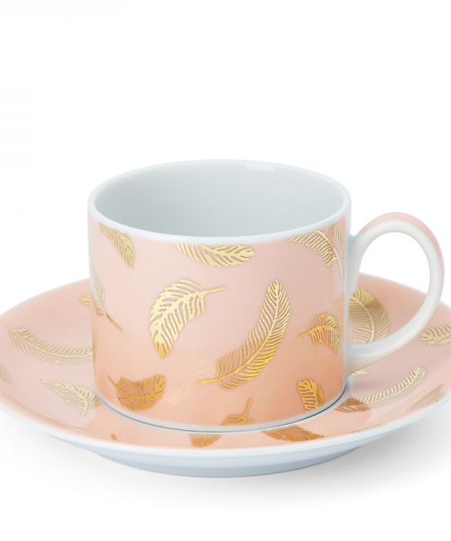 Powder pink tea and coffee cup with a saucer